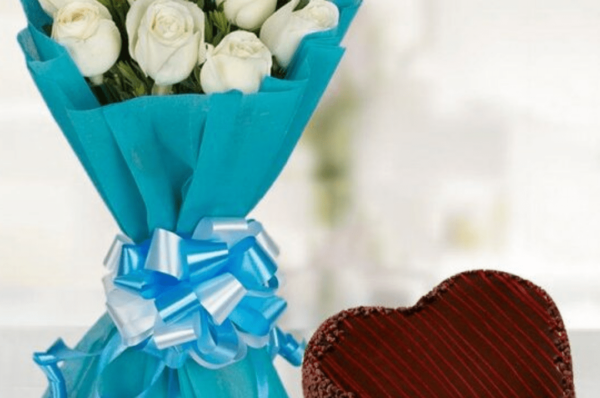 white roses with heart shape cake