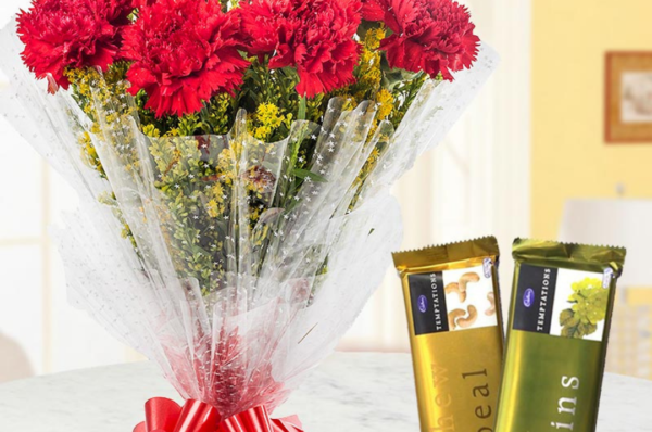 red carnation bouquet with chocolate