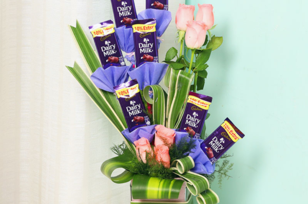 dairy milk and pink rose bouquet