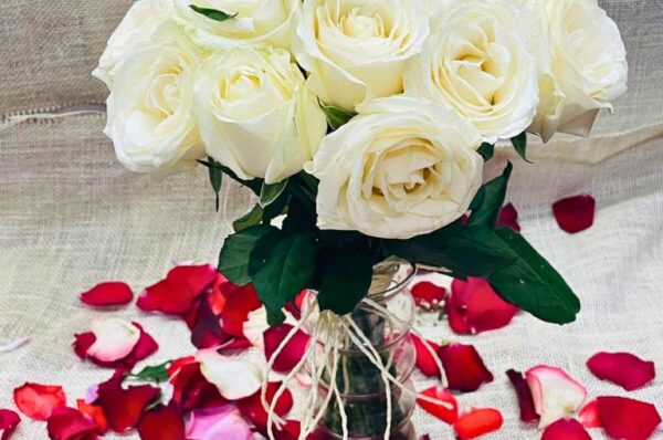 White Roses in Glass Vase